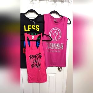 three Zumba tank tops